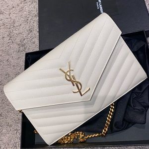 Saint Laurent
Monogram chevron-quilted chain wallet